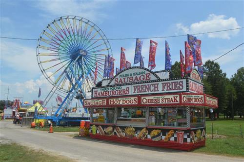 spring carnival ferris wheel and food stand 